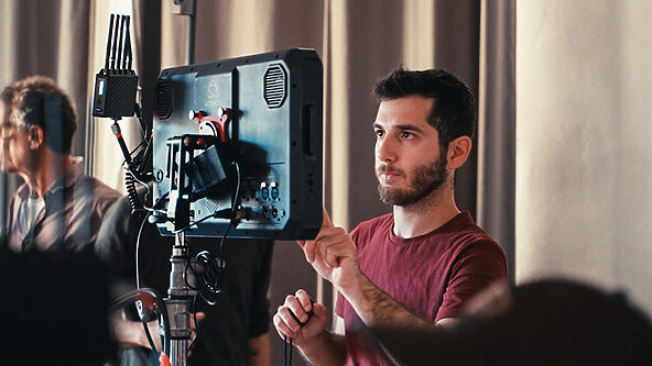 MAKA's Senior Video Creative Director reviewing footage live from a shoot
